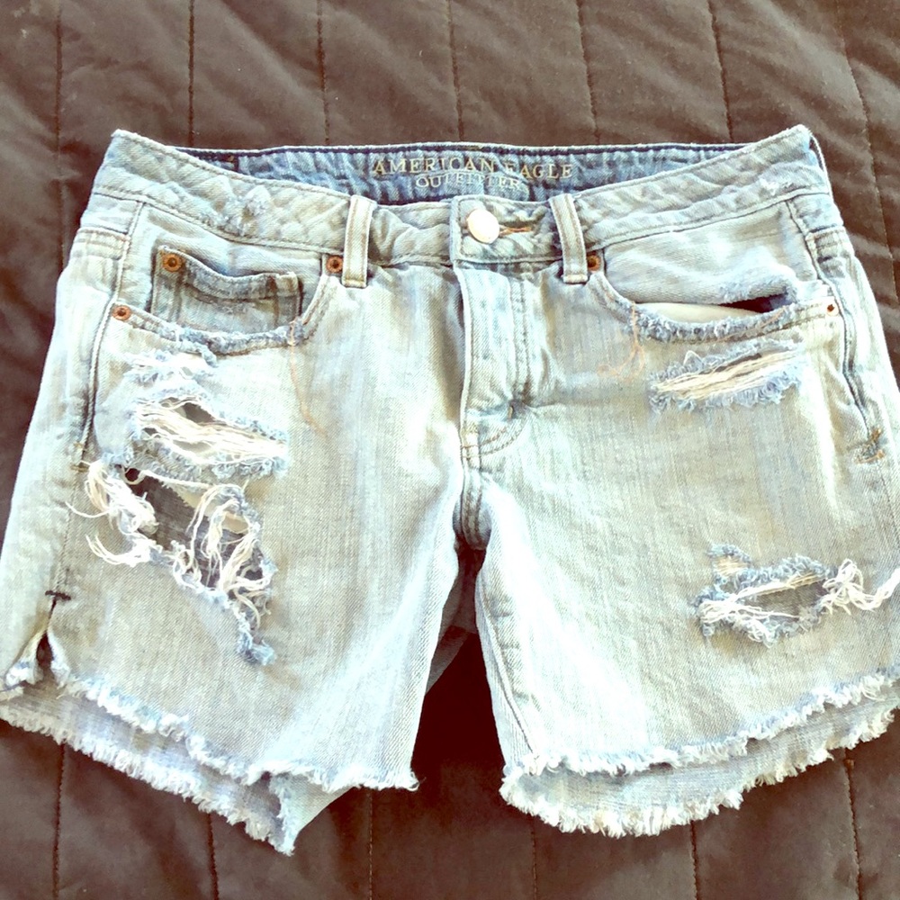 AE distressed light wash cut offs